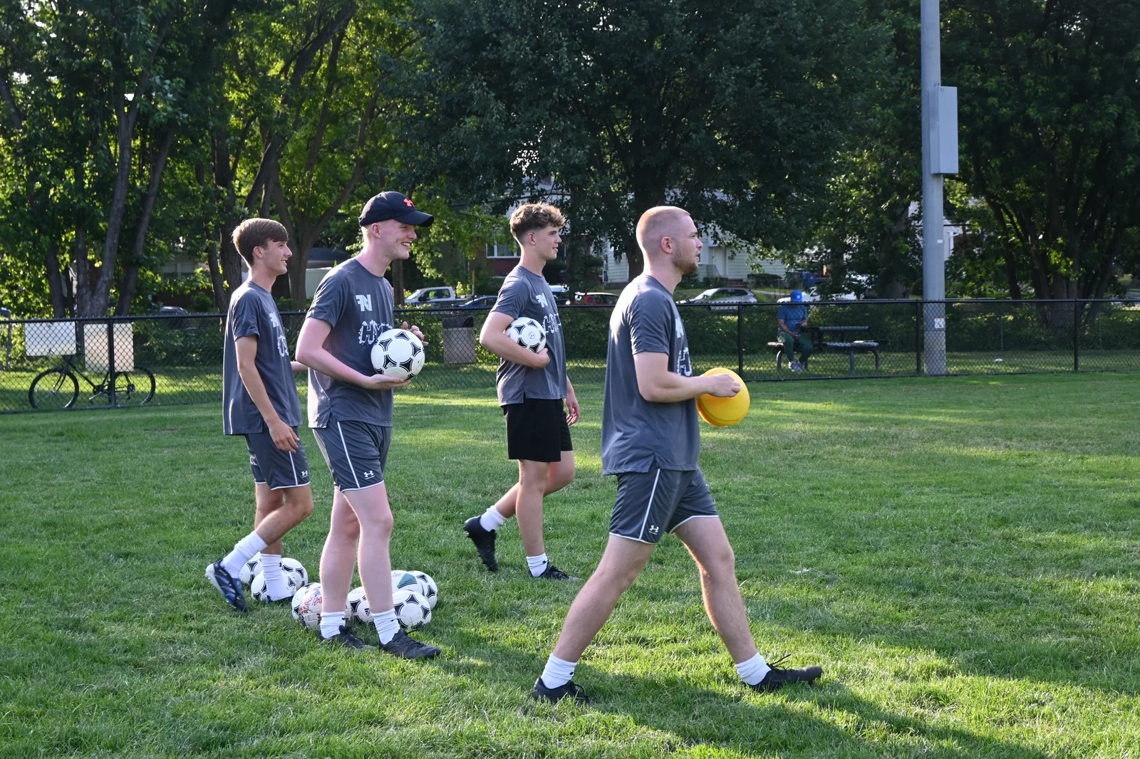 Staff carrying balls and cones