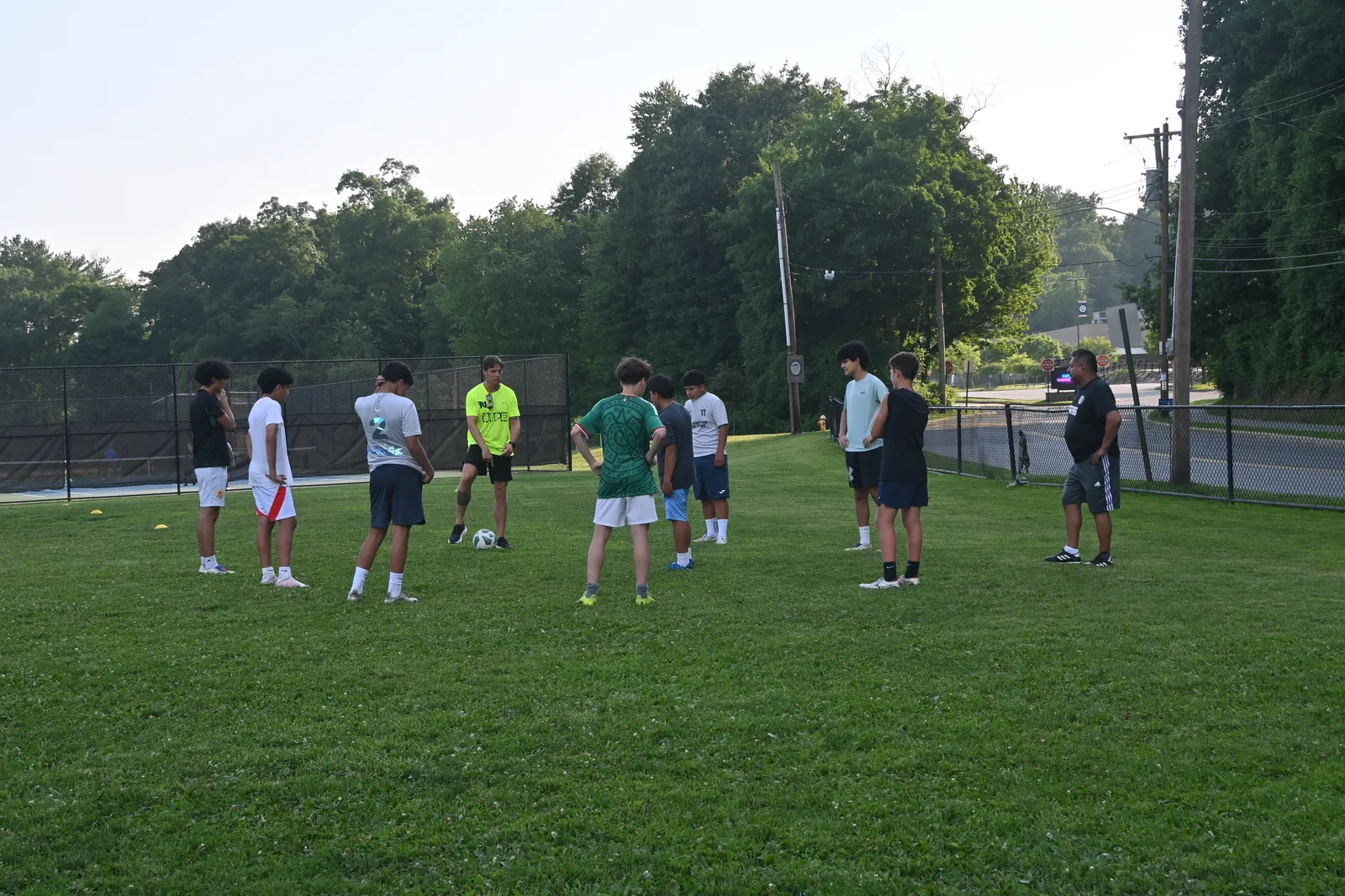 Coach giving instructions to U11 players